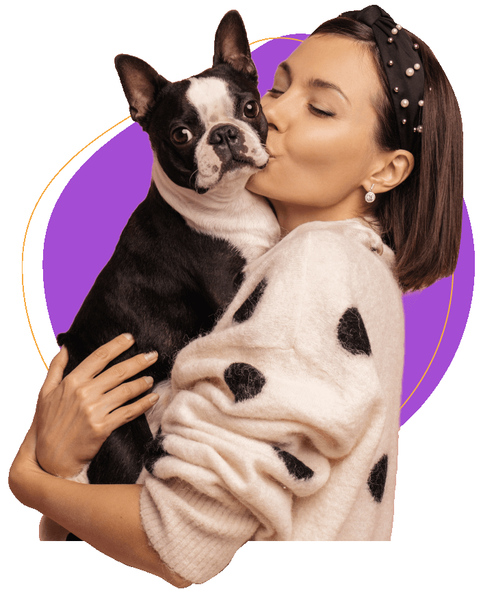 Happy girl kissing her pet dog image